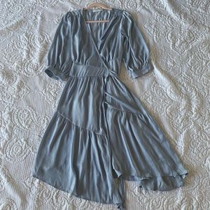 A dusty blue midi wrap dress